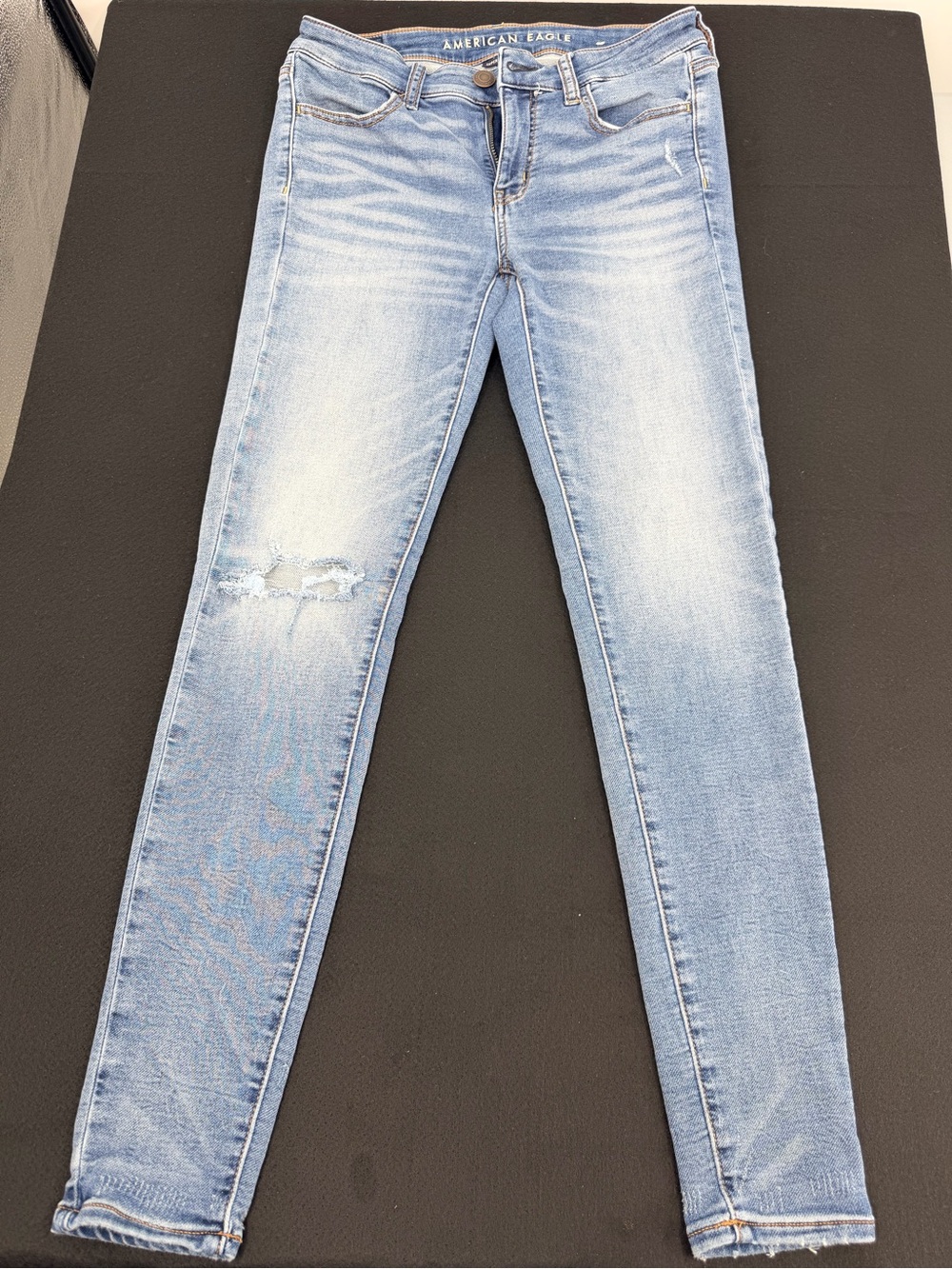 American Eagle Outfitters Light Blue Skinny Jeans with Distressed Knee
